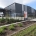 Image showing a black aluminium security sliding gate, in front of the NCI Packaging building in Auckland, installed by Fencerite