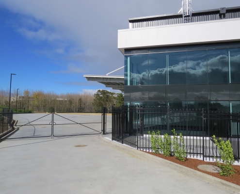 Image showing the entrance to a commercial building, with swing gate, installed by Fencerite