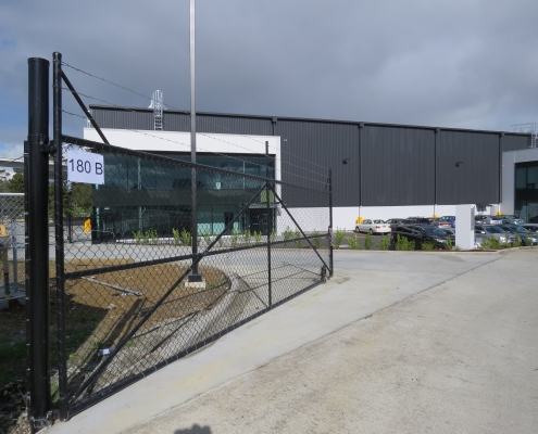 Image showing the entrance to a commercial building, with swing gate, installed by Fencerite