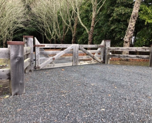 Image showing a wooden gate, at the entrance of a rural property, installed by Fencerite