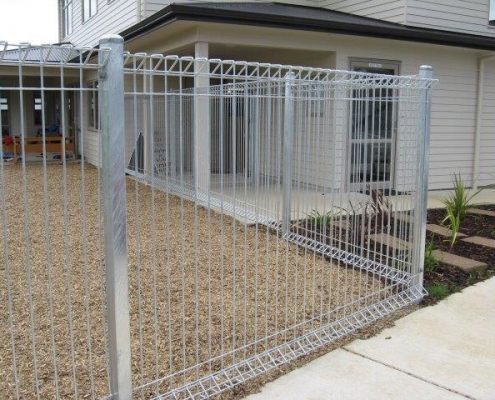 Image showing school fencing, enclosing an outdoor playing area by a school building, installed by Fencerite